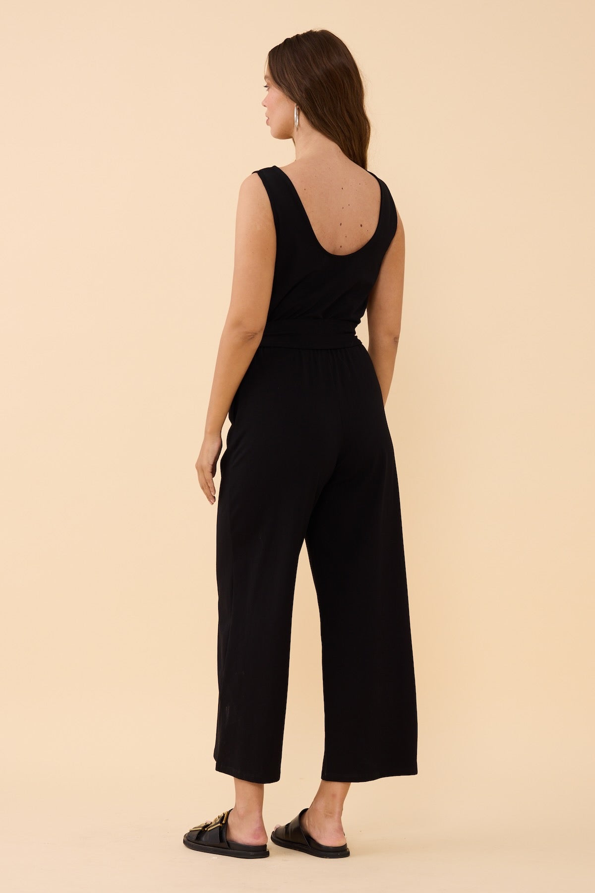 Woman wearing the Frock Me Out Black Sleeveless Stretch Jumpsuit