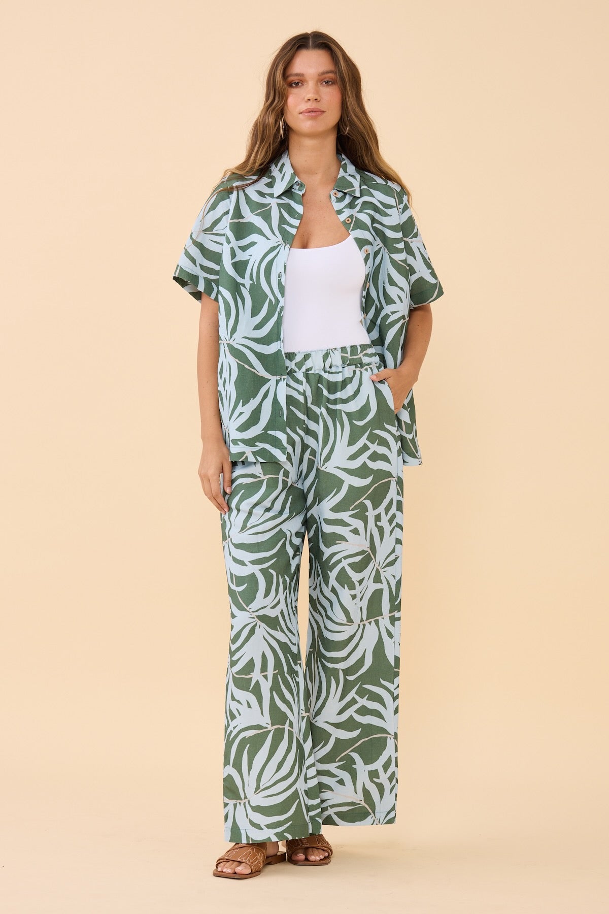 Woman wearing matching Frock Me Out Lets Be Fronds shirt and pants set 