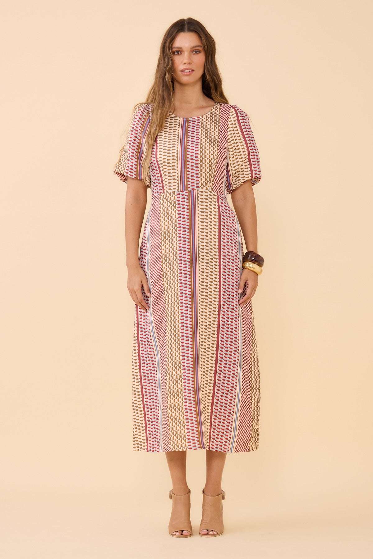 Woman wearing Frock Me Out Resort Mod Shapeshifter Dress standing front on