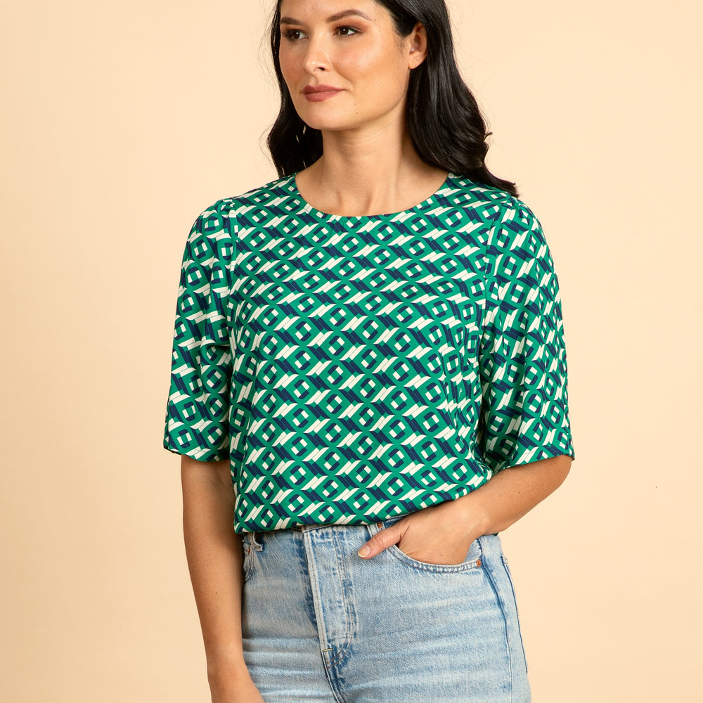 
                      
                        ARCHED Fluted Sleeve Top
                      
                    