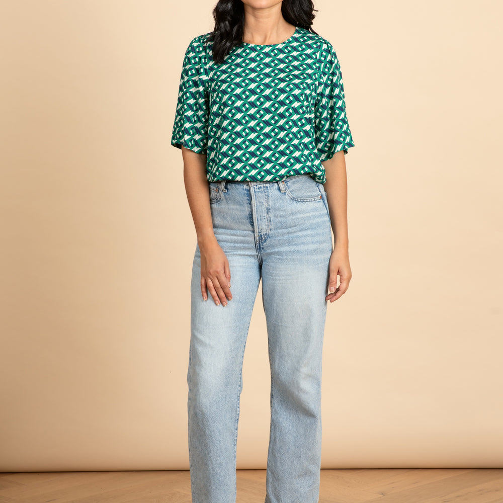 
                      
                        ARCHED Fluted Sleeve Top
                      
                    