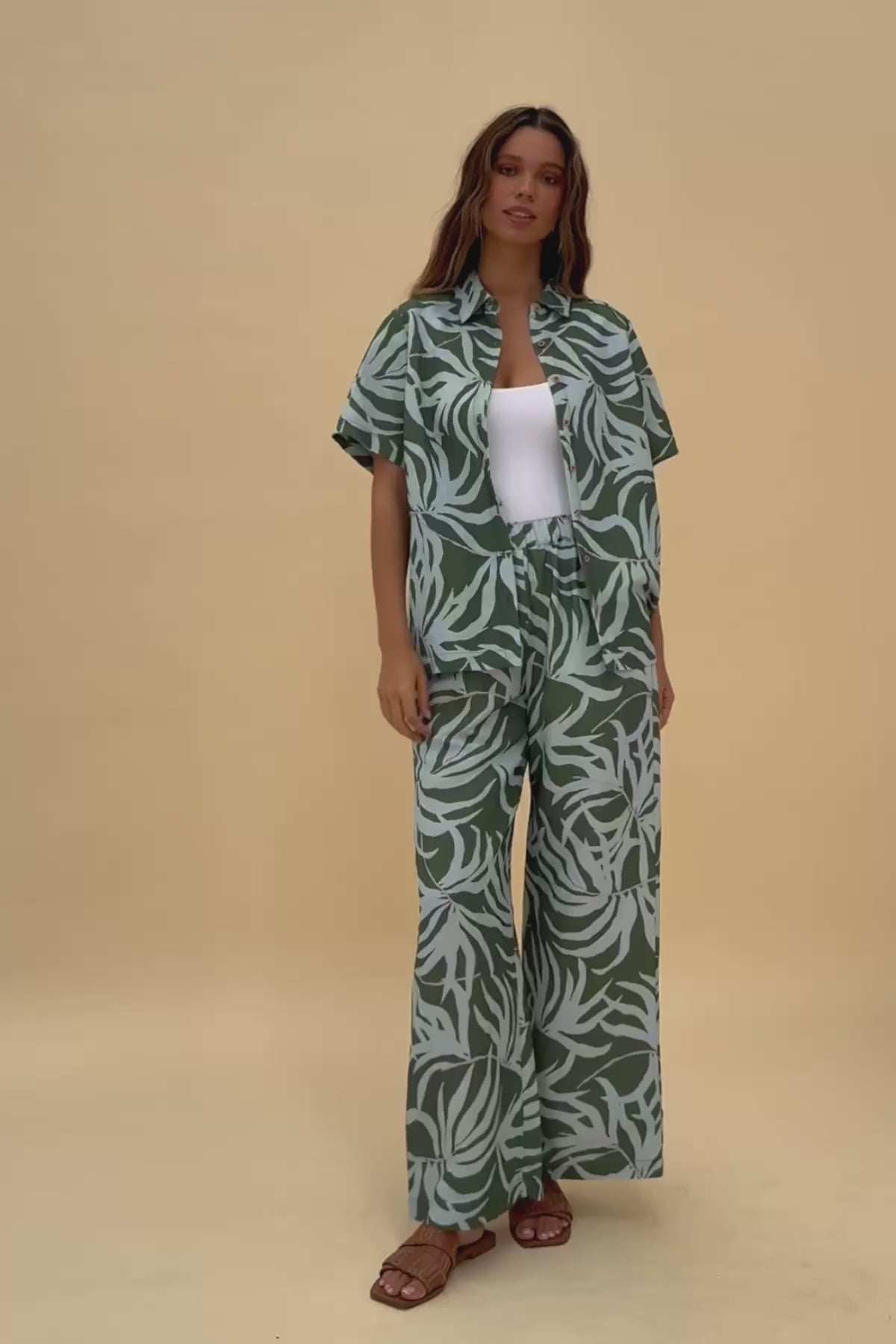 Woman wearing matching Frock Me Out Lets Be Fronds shirt and pants set 